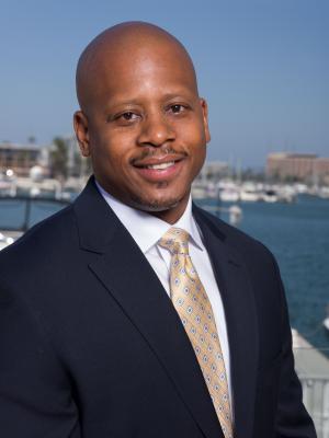 Acting Dean Barrett smiling in headshot