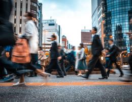 people blurry walking on a street