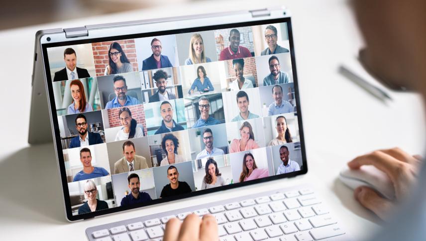 person using laptop to connect to people in online meeting