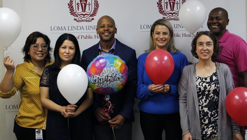 School of Public Health administration celebrate with balloons